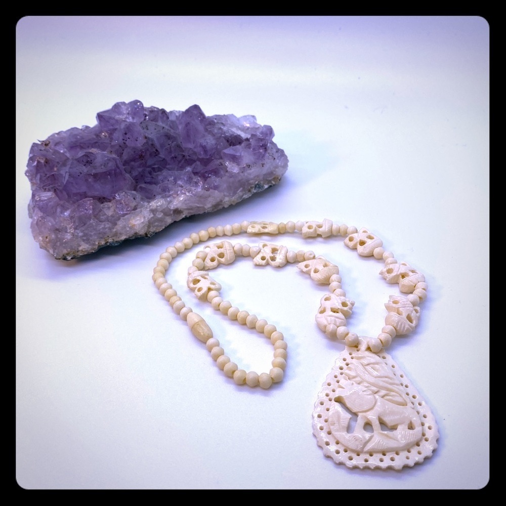 Necklace with Carved Animal Design